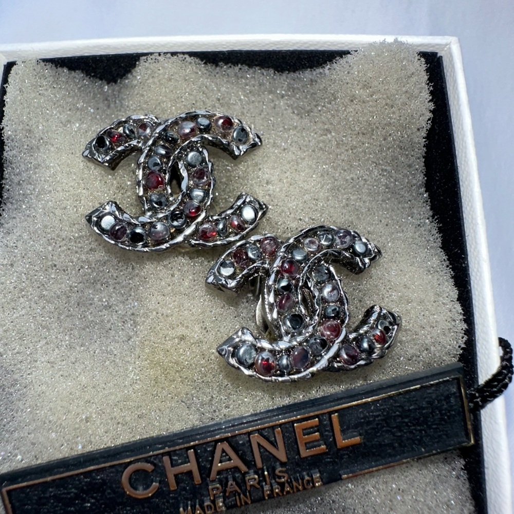 Chanel CC logo clip on multi colored earrings. Red, black, silver and blue